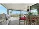 Spacious waterfront deck with outdoor kitchen and seating area at 7418 Westmoreland Dr, Sarasota, FL 34243