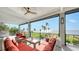 Relaxing waterfront deck featuring wicker furniture and stunning water views at 7418 Westmoreland Dr, Sarasota, FL 34243