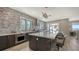 Gourmet kitchen with island, stainless steel appliances, and waterfront views at 7418 Westmoreland Dr, Sarasota, FL 34243