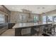 Modern kitchen with stainless steel appliances, quartz countertops, and large island at 7418 Westmoreland Dr, Sarasota, FL 34243