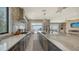 Modern kitchen features expansive countertops, stainless steel appliances, and water views at 7418 Westmoreland Dr, Sarasota, FL 34243
