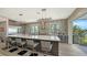 Modern kitchen with stainless steel appliances, quartz countertops, and large island at 7418 Westmoreland Dr, Sarasota, FL 34243