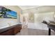 Home office with built-in desk, hardwood floors, and plenty of natural light at 7418 Westmoreland Dr, Sarasota, FL 34243
