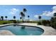 Relaxing kidney-shaped pool with a tranquil water view at 7418 Westmoreland Dr, Sarasota, FL 34243