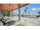 Inviting pool area with lounge chairs and wooden pergola at 7418 Westmoreland Dr, Sarasota, FL 34243