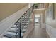 Modern staircase with metal railing and hardwood treads at 7418 Westmoreland Dr, Sarasota, FL 34243