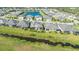 Aerial view of home showcasing backyard lanai and canal view at 7525 Alumni Trl, Sarasota, FL 34243