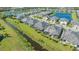 Aerial view of home showcasing backyard lanai and canal view at 7525 Alumni Trl, Sarasota, FL 34243