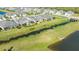 Aerial view of home showcasing backyard lanai and canal view at 7525 Alumni Trl, Sarasota, FL 34243