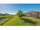 Enjoy the backyard view, with canal and lush green grass at 7525 Alumni Trl, Sarasota, FL 34243