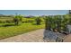 Spacious paver patio in a lush backyard setting with tropical landscaping at 7525 Alumni Trl, Sarasota, FL 34243