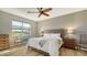 Bright bedroom with a king-size bed, wood floors, and plenty of natural light at 7525 Alumni Trl, Sarasota, FL 34243