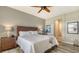 King bedroom with wood flooring, large windows and ensuite access at 7525 Alumni Trl, Sarasota, FL 34243