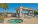 Relaxing hot tub with surrounding patio and landscaping at 7525 Alumni Trl, Sarasota, FL 34243