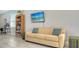Community lounge with a sofa, TV and bookcase at 7525 Alumni Trl, Sarasota, FL 34243