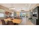 Dining area with wood table and access to backyard at 7525 Alumni Trl, Sarasota, FL 34243