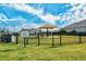 Fenced dog park with shaded seating area at 7525 Alumni Trl, Sarasota, FL 34243
