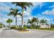 Community entrance with signage and landscaping at 7525 Alumni Trl, Sarasota, FL 34243