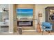 Modern electric fireplace with wood-look wall and TV at 7525 Alumni Trl, Sarasota, FL 34243