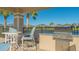Outdoor grilling station with seating for poolside dining at 7525 Alumni Trl, Sarasota, FL 34243