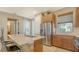 Island kitchen with stainless steel appliances and breakfast bar at 7525 Alumni Trl, Sarasota, FL 34243