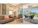 Cozy living room with sliding glass doors leading to a screened patio at 7525 Alumni Trl, Sarasota, FL 34243