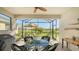 Relaxing screened patio with outdoor seating and golf course views at 7525 Alumni Trl, Sarasota, FL 34243