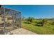 Screened patio with paver stones and view of the canal at 7525 Alumni Trl, Sarasota, FL 34243