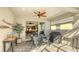 Covered patio with seating area, grill, and view of backyard at 7525 Alumni Trl, Sarasota, FL 34243