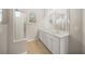 Bathroom with double vanity and walk-in shower at 7704 32Nd E St, Sarasota, FL 34243