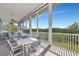 Relaxing screened porch with outdoor furniture and scenic view at 807 Waterside Ln, Bradenton, FL 34209