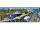 Aerial view of waterfront property with private dock and boat lift at 834 Jungle Queen Way, Longboat Key, FL 34228