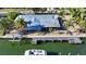 Aerial view of waterfront home with private dock and boat at 834 Jungle Queen Way, Longboat Key, FL 34228