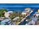 Aerial view of property on the water with private dock at 834 Jungle Queen Way, Longboat Key, FL 34228