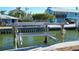 Private boat lift for convenient water access at 834 Jungle Queen Way, Longboat Key, FL 34228