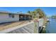 Wooden dock providing waterfront access and relaxation at 834 Jungle Queen Way, Longboat Key, FL 34228