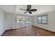 Room with tile floors, sliding doors, and ceiling fan at 834 Jungle Queen Way, Longboat Key, FL 34228