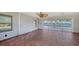 Bright sunroom with tiled floor, sliding doors, and water views at 834 Jungle Queen Way, Longboat Key, FL 34228
