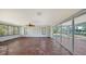 Bright sunroom with tile floors, sliding glass doors, and a view at 834 Jungle Queen Way, Longboat Key, FL 34228