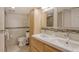 Bathroom features double sinks, a large shower and light beige tile at 8767 Midnight Pass Rd # 203F, Sarasota, FL 34242