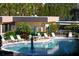 Community pool with lounge chairs and patio tables with umbrellas at 8767 Midnight Pass Rd # 203F, Sarasota, FL 34242