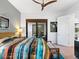 Serene bedroom with a queen bed, and sliding glass doors leading to the backyard at 9224 Starry Night Ave, Sarasota, FL 34241