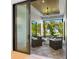 Relaxing covered patio with wicker furniture and tranquil views at 9224 Starry Night Ave, Sarasota, FL 34241