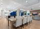 Open concept dining room with modern light fixture at 9224 Starry Night Ave, Sarasota, FL 34241