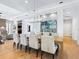 Elegant dining room with large table and statement lighting fixture at 9224 Starry Night Ave, Sarasota, FL 34241