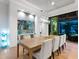 Elegant dining area with large table and access to backyard at 9224 Starry Night Ave, Sarasota, FL 34241