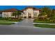 House exterior at dusk showcasing landscaping and driveway at 9224 Starry Night Ave, Sarasota, FL 34241