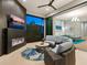 Gathering room with fireplace, TV, and views of the backyard at 9224 Starry Night Ave, Sarasota, FL 34241