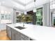Gourmet kitchen with large island, sink and views of the pool at 9224 Starry Night Ave, Sarasota, FL 34241