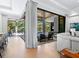 Indoor-outdoor living space with access to the pool and lanai at 9224 Starry Night Ave, Sarasota, FL 34241